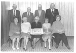 Group Photo of the Class of 1943 and Spouses at 50 Year Reunion Dinner Holding a Cake by George Fox University Archives