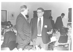 Two Men Talking at The Class of 1943 Reunion at Homecoming 1993 February by George Fox University Archives