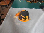 Beanie with 28 and Tassel by George Fox University Archives