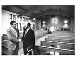 Tigard Friends, Men Shaking Hands in Sanctuary by George Fox University Archives