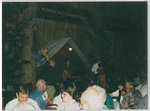 Man Playing the Guitar at Camp Tilikum Being Accompanied by a Lady Playing the Violin by George Fox University Archives